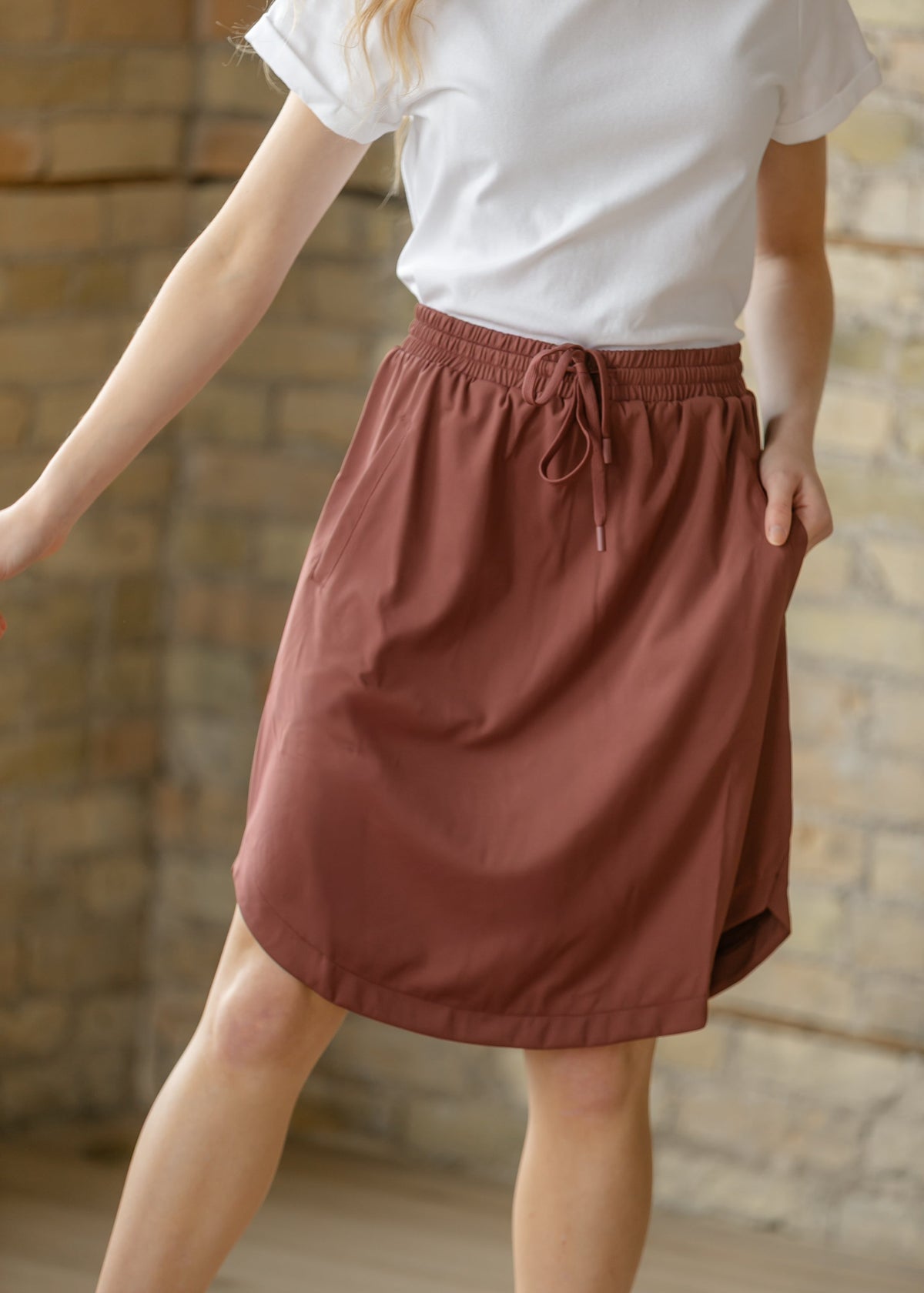 Kenedi mulberry athletic skirt with built-in shorts — front view